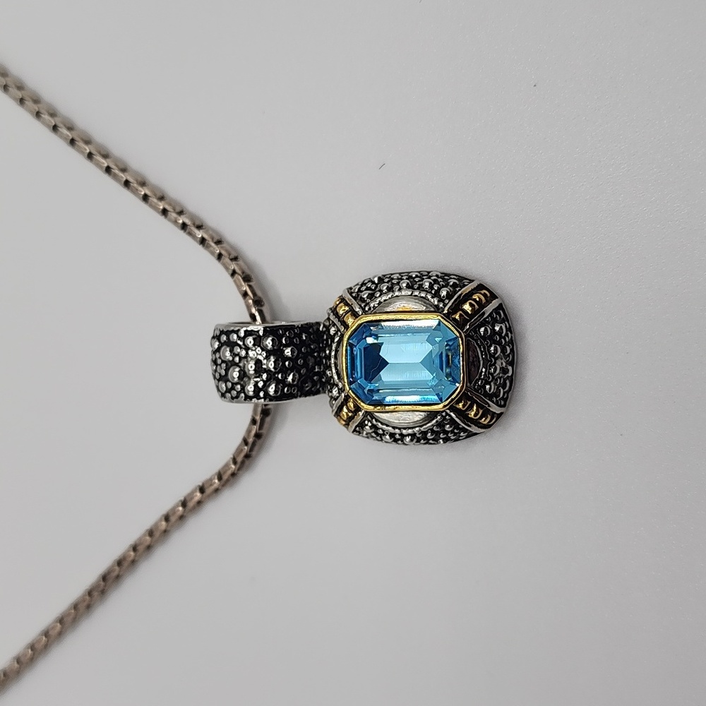 Costume Silver and gold tone Necklace with Blue Accent Gem.